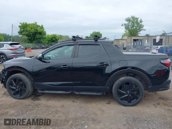 2023 Hyundai Santa Cruz Night Edition с VIN 5NTJCDAF0PH051549, выставлен на аукционе IAAI как лот 42600260 с пробегом 37 876 миль миль и . История ставок и продаж доступна на DreamBid. Изображение 15.
