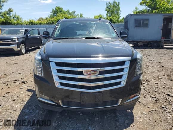 2020 Cadillac Escalade Luxury с VIN 1GYS4BKJ0LR154104, выставлен на аукционе Copart как лот 57810965 с пробегом 75 806 миль миль и Списание • Salvage title. История ставок и продаж доступна на DreamBid. Изображение 5.