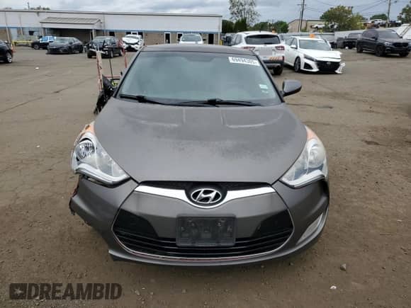 2014 Hyundai Veloster z VIN KMHTC6AD0EU196106, wystawiony jako Copart lot #69494305 z przebiegiem 102 472 mil mil oraz Szkoda całkowita • Salvage title. Historia ofert i sprzedaży dostępna na DreamBid. Obrazek 5.