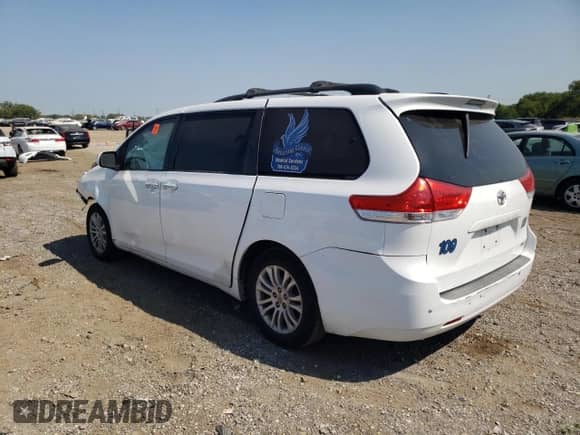 2014 Toyota Sienna XLE с VIN 5TDYK3DC6ES526303, выставлен на аукционе Copart как лот 72060215 с пробегом Не указан миль и Списание • Salvage title. История ставок и продаж доступна на DreamBid. Изображение 2.