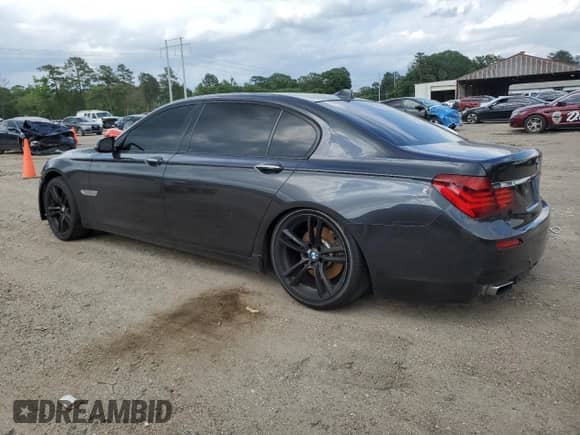 2014 BMW 7 Series 740Li with VIN WBAYE4C52ED137991, listed as a Copart auction lot 54702135 with 145,375 mi miles and Salvage title. Bid and sale history available at DreamBid. Image 2.