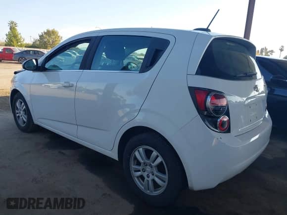 2015 Chevrolet Sonic LT with VIN 1G1JC6SH2F4121897, listed as a IAAI auction lot 43310992 with 128,444 mi miles and . Bid and sale history available at DreamBid. Image 3.