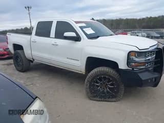 2018 Chevrolet Silverado 1500 LT z VIN 3GCUKREC2JG223527, wystawiony jako IAAI lot #38551870 z przebiegiem 99 916 mil mil oraz . Historia ofert i sprzedaży dostępna na DreamBid. Obrazek 1.