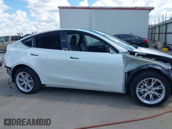 2023 Tesla Model Y Long Range with VIN 7SAYGDEE6PA078790, listed as a IAAI auction lot 43261075 with 20,370 mi miles and . Bid and sale history available at DreamBid. Image 14.