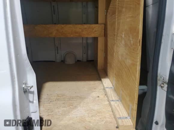 2006 Chevrolet Express Cargo с VIN 1GCFH15T561200645, выставлен на аукционе Copart как лот 70101675 с пробегом 98 059 миль миль и Списание • Salvage title. История ставок и продаж доступна на DreamBid. Изображение 10.