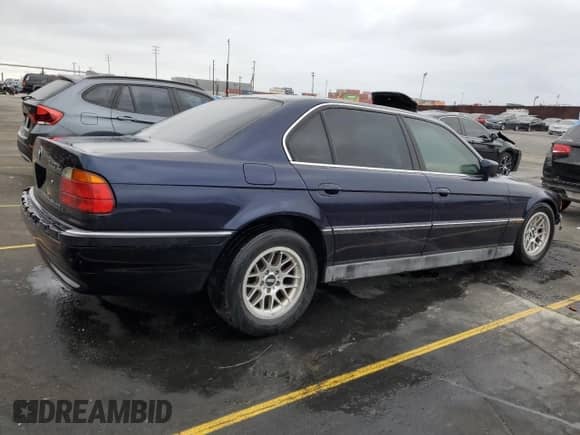 1998 BMW 7 Series 740iL with VIN WBAGJ8321WDM23045, listed as a Copart auction lot 87018324 with 43,906 mi miles and Salvage title. Bid and sale history available at DreamBid. Image 3.