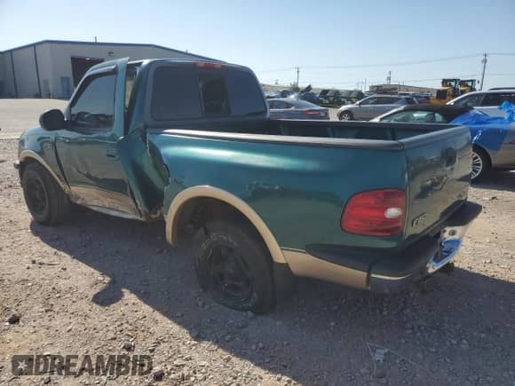 1997 Ford F-150 XL with VIN 1FTDF07W6VKA71774, listed as a Copart auction lot 66630614 with 132,684 mi miles and Salvage title. Bid and sale history available at DreamBid. Image 2.