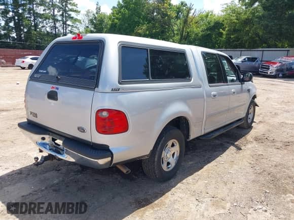 2002 Ford F-150 XLT with VIN 1FTRW07602KB73444, listed as a IAAI auction lot 42744286 with 208,152 mi miles and . Bid and sale history available at DreamBid. Image 4.