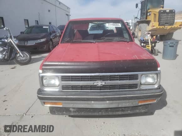 1991 Chevrolet S-10 z VIN 1GCCS19Z4M0204465, wystawiony jako Copart lot #77198684 z przebiegiem 147 796 mil mil oraz Szkoda całkowita • Salvage title. Historia ofert i sprzedaży dostępna na DreamBid. Obrazek 5.