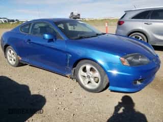 2006 Hyundai Tiburon SE с VIN KMHHN65D06U230928, выставлен на аукционе Copart как лот 72745854 с пробегом 246 837 миль миль и Чистый • Clean title. История ставок и продаж доступна на DreamBid. Изображение 4.