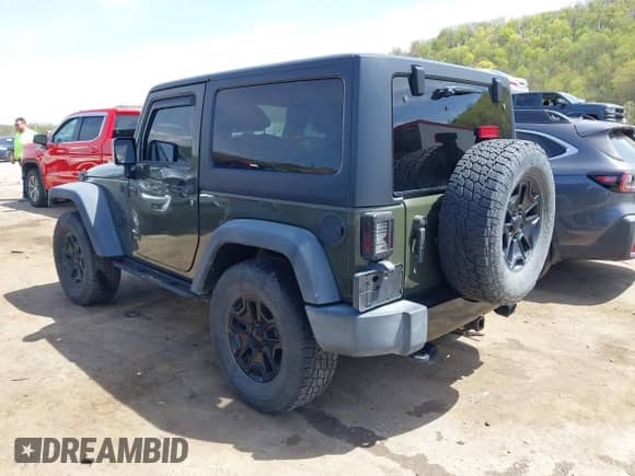 2015 Jeep Wrangler Sport with VIN 1C4AJWAG1FL714131, listed as a IAAI auction lot 42112376 with 81,998 mi miles and . Bid and sale history available at DreamBid. Image 3.