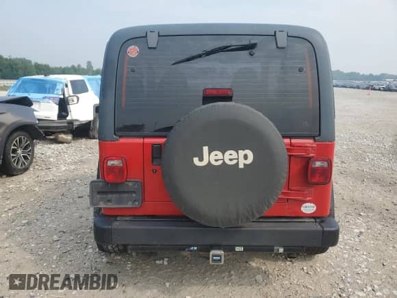 1998 Jeep Wrangler SE with VIN 1J4FY29P9WP736055, listed as a Copart auction lot 66898815 with 84,686 mi miles and Clean title. Bid and sale history available at DreamBid. Image 6.