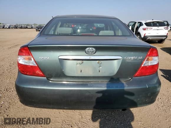 2003 Toyota Camry LE z VIN JTDBE32K030139057, wystawiony jako Copart lot #71503125 z przebiegiem 74 753 mil mil oraz Szkoda całkowita • Salvage title. Historia ofert i sprzedaży dostępna na DreamBid. Obrazek 6.