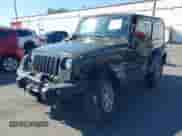 2015 Jeep Wrangler Rubicon Hard Rock z VIN 1C4BJWCGXFL771669, wystawiony jako IAAI lot #42057423 z przebiegiem 36 996 mil mil oraz . Historia ofert i sprzedaży dostępna na DreamBid. Obrazek 2.
