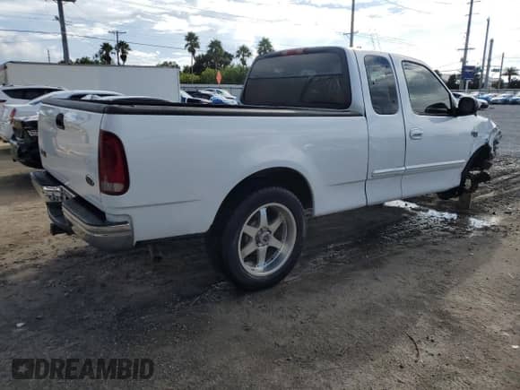 2002 Ford F-150 XL with VIN 1FTRX17LX2KC01615, listed as a Copart auction lot 85391495 with 176,921 mi miles and Salvage title. Bid and sale history available at DreamBid. Image 3.