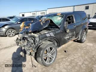 2011 Dodge Nitro with VIN 1D4PU6GXXBW582734, listed as a Copart auction lot 46457595 with 233,233 mi miles and Salvage title. Bid and sale history available at DreamBid. Image 1.