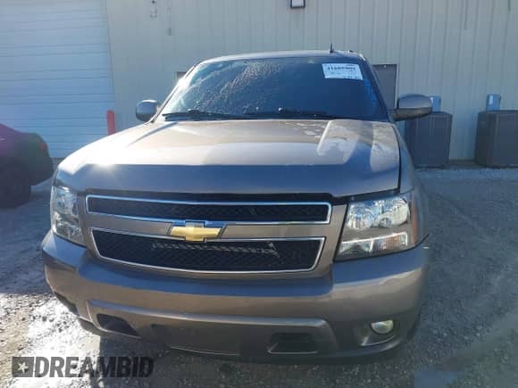 2011 Chevrolet Suburban LT z VIN 1GNSCJE09BR344091, wystawiony jako IAAI lot #41605909 z przebiegiem 312 559 mil mil oraz . Historia ofert i sprzedaży dostępna na DreamBid. Obrazek 12.