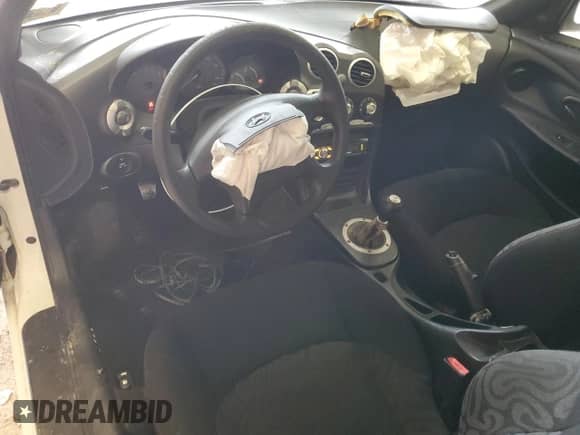 2000 Hyundai Tiburon with VIN KMHJG25F1YU217419, listed as a Copart auction lot 54772515 with 155,023 mi miles and Salvage title. Bid and sale history available at DreamBid. Image 8.