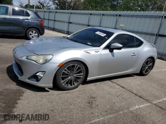 2014 Scion FR-S with VIN JF1ZNAA12E8703460, listed as a Copart auction lot 70888595 with 146,454 mi miles and Salvage title. Bid and sale history available at DreamBid. Image 1.