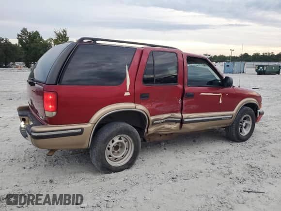 1999 Chevrolet Blazer LS с VIN 1GNCS13WXX2126904, выставлен на аукционе Copart как лот 69987244 с пробегом 384 028 миль миль и Списание • Salvage title. История ставок и продаж доступна на DreamBid. Изображение 3.