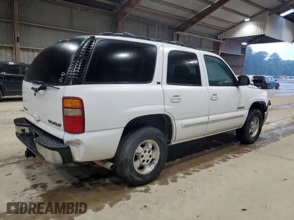 2003 Chevrolet Tahoe LS z VIN 1GNEC13Z33R281053, wystawiony jako Copart lot #69859815 z przebiegiem 167 551 mil mil oraz Szkoda całkowita • Salvage title. Historia ofert i sprzedaży dostępna na DreamBid. Obrazek 3.