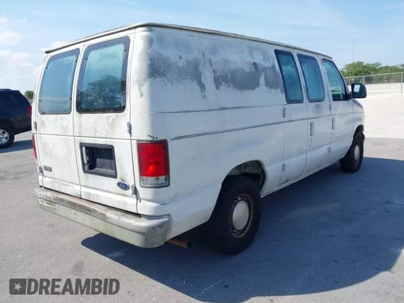 1999 Ford Econoline Cargo with VIN 1FTRE1428XHA20390, listed as a IAAI auction lot 41806875 with 207,954 mi miles and . Bid and sale history available at DreamBid. Image 4.