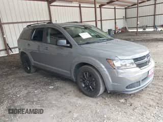 2020 Dodge Journey SE Value with VIN 3C4PDCABXLT259669, listed as a IAAI auction lot 42995598 with 98,957 mi miles and . Bid and sale history available at DreamBid. Image 1.