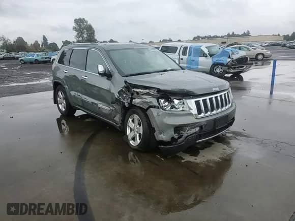 2012 Jeep Grand Cherokee Limited z VIN 1C4RJFBG2CC187150, wystawiony jako Copart lot #84956805 z przebiegiem 136 040 mil mil oraz Szkoda całkowita • Salvage title. Historia ofert i sprzedaży dostępna na DreamBid. Obrazek 13.
