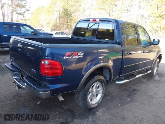 2002 Ford F-150 XLT with VIN 1FTRW086X2KE17566, listed as a IAAI auction lot 41721236 with 98,524 mi miles and . Bid and sale history available at DreamBid. Image 4.