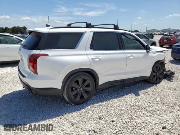 2023 Hyundai Palisade XRT с VIN KM8R34GE7PU556151, выставлен на аукционе Copart как лот 67518644 с пробегом 33 553 миль миль и Списание • Salvage title. История ставок и продаж доступна на DreamBid. Изображение 3.