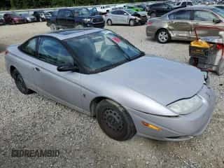 2001 Saturn SC с VIN 1G8ZP12851Z215716, выставлен на аукционе Copart как лот 69665754 с пробегом Не указан миль и Списание • Salvage title. История ставок и продаж доступна на DreamBid. Изображение 4.
