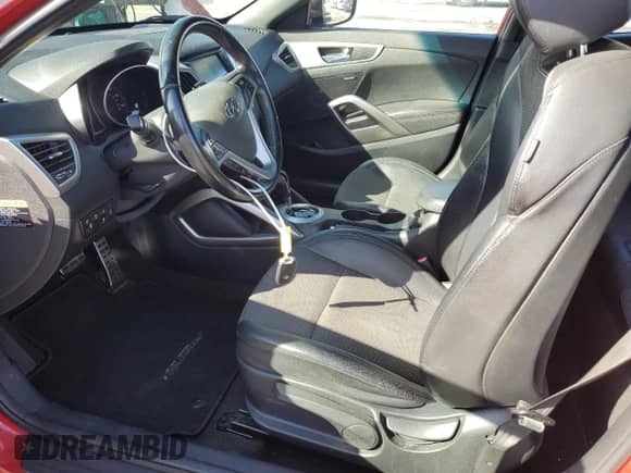 2016 Hyundai Veloster z VIN KMHTC6AD5GU297483, wystawiony jako Copart lot #84792885 z przebiegiem 64 149 mil mil oraz Szkoda całkowita • Salvage title. Historia ofert i sprzedaży dostępna na DreamBid. Obrazek 7.