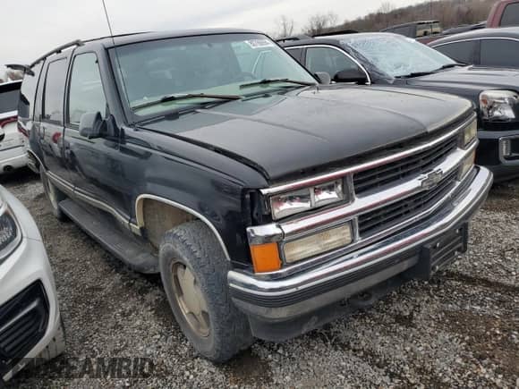 1997 Chevrolet Suburban with VIN 3GNFK16R5VG178674, listed as a Copart auction lot 80760694 with 248,492 mi miles and Salvage title. Bid and sale history available at DreamBid. Image 4.