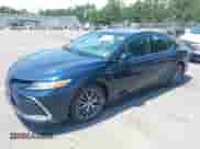 2021 Toyota Camry Hybrid XLE with VIN 4T1F31AK3MU554067, listed as a IAAI auction lot 42681018 with 53,630 mi miles and . Bid and sale history available at DreamBid. Image 2.