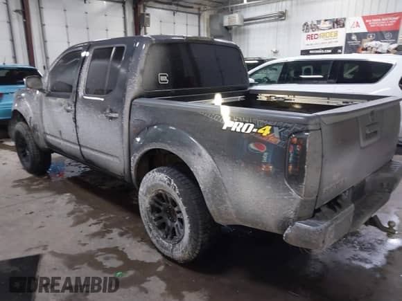 2013 Nissan Frontier SV with VIN 1N6AD0EV5DN734619, listed as a IAAI auction lot 41300993 with 104,013 mi miles and . Bid and sale history available at DreamBid. Image 3.