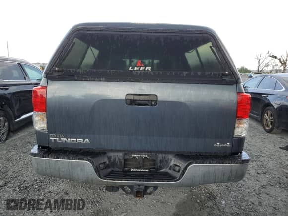 2010 Toyota Tundra with VIN 5TFUM5F10AX005744, listed as a Copart auction lot 80795575 with 120,996 mi miles and Salvage title. Bid and sale history available at DreamBid. Image 6.