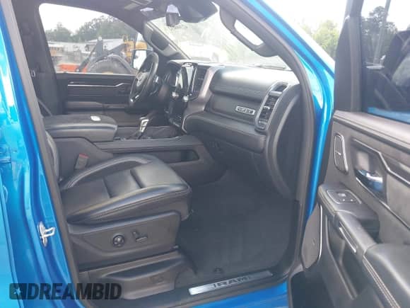 2021 Ram 1500 TRX with VIN 1C6SRFU98MN804461, listed as a IAAI auction lot 42300032 with 28,735 mi miles and . Bid and sale history available at DreamBid. Image 5.