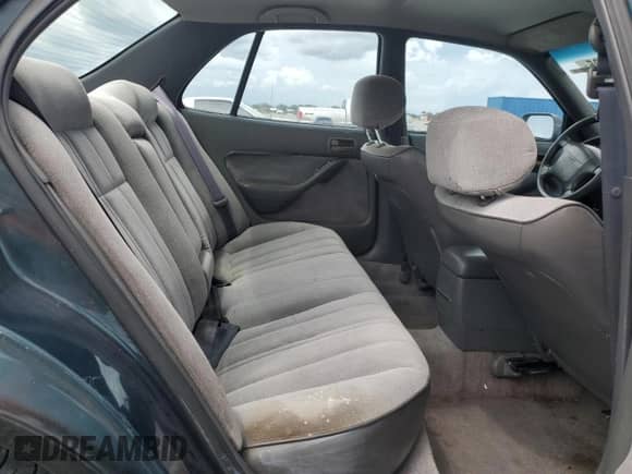 1996 Toyota Camry DX z VIN 4T1BG12K7TU811280, wystawiony jako Copart lot #72037795 z przebiegiem 110 064 mil mil oraz Szkoda całkowita • Salvage title. Historia ofert i sprzedaży dostępna na DreamBid. Obrazek 10.