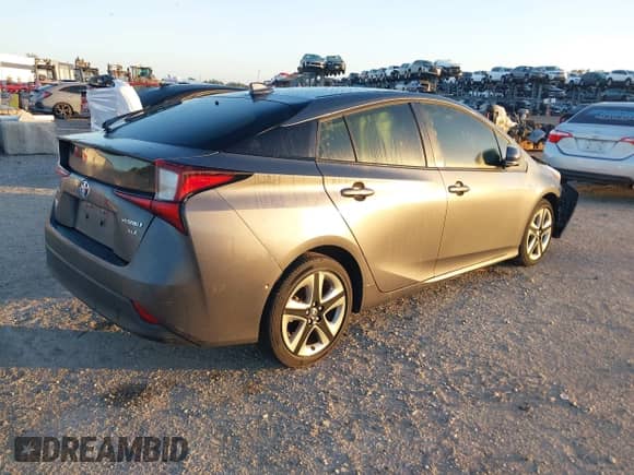 2022 Toyota Prius L Eco with VIN JTDKAMFU4N3175879, listed as a IAAI auction lot 43407344 with 15,599 mi miles and . Bid and sale history available at DreamBid. Image 4.