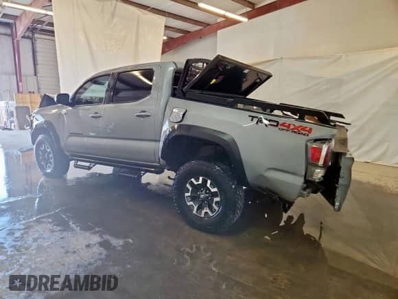 2021 Toyota Tacoma SR with VIN 5TFCZ5AN2MX251688, listed as a Copart auction lot 80790625 with 129,693 mi miles and Salvage title. Bid and sale history available at DreamBid. Image 2.