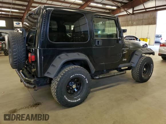 1999 Jeep Wrangler Sport z VIN 1J4FY19S0XP487645, wystawiony jako Copart lot #84068725 z przebiegiem 197 001 mil mil oraz Czysty tytuł • Clean title. Historia ofert i sprzedaży dostępna na DreamBid. Obrazek 3.