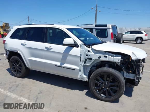 2018 Jeep Grand Cherokee Altitude with VIN 1C4RJEAG2JC404009, listed as a IAAI auction lot 42691304 with 60,948 mi miles and . Bid and sale history available at DreamBid. Image 14.