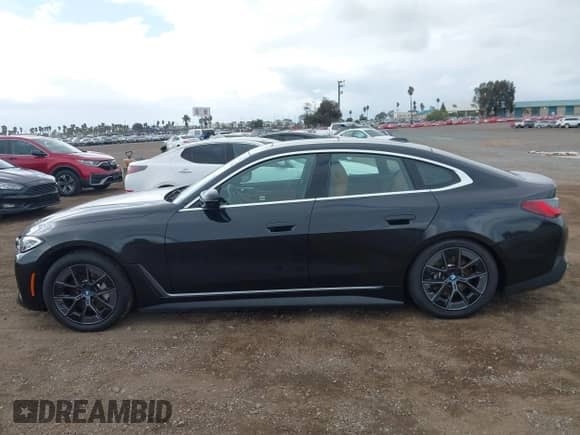 2022 BMW i4 eDrive40 with VIN WBY73AW06NFN15669, listed as a IAAI auction lot 43364913 with 29,451 mi miles and . Bid and sale history available at DreamBid. Image 14.