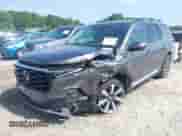 2023 Honda Pilot Elite with VIN 5FNYG1H8XPB040628, listed as a IAAI auction lot 42718726 with 28,663 mi miles and . Bid and sale history available at DreamBid. Image 2.