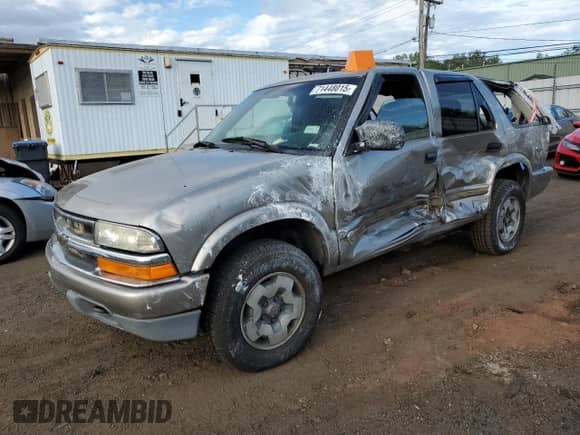2003 Chevrolet Blazer LS with VIN 1GNDT13X73K152980, listed as a Copart auction lot 71448015 with 102,250 mi miles and Salvage title. Bid and sale history available at DreamBid. Image 1.