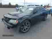 2014 Chrysler 300 SRT-8 with VIN 2C3CCAFJ9EH171489, listed as a IAAI auction lot 43108178 with 122,509 mi miles and . Bid and sale history available at DreamBid. Image 2.