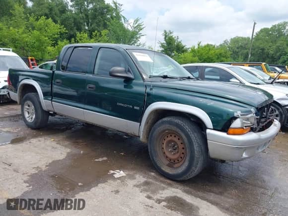 2002 Dodge Dakota SLT with VIN 1B7HL48N72S640361, listed as a IAAI auction lot 42430951 with 197,267 mi miles and . Bid and sale history available at DreamBid. Image 1.