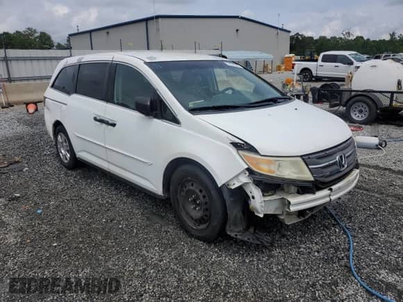 2011 Honda Odyssey LX with VIN 5FNRL5H28BB104371, listed as a Copart auction lot 57581065 with 240,298 mi miles and Salvage title. Bid and sale history available at DreamBid. Image 4.