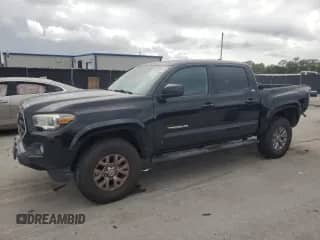 2017 Toyota Tacoma SR5 with VIN 5TFAZ5CN1HX027340, listed as a Copart auction lot 82281075 with 97,369 mi miles and Salvage title. Bid and sale history available at DreamBid. Image 1.