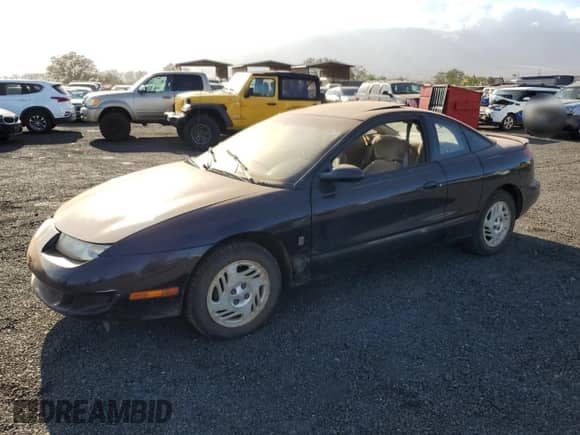 1999 Saturn SC with VIN 1G8ZR1274XZ262181, listed as a Copart auction lot 75931774 with Not provided miles and Salvage title. Bid and sale history available at DreamBid. Image 1.